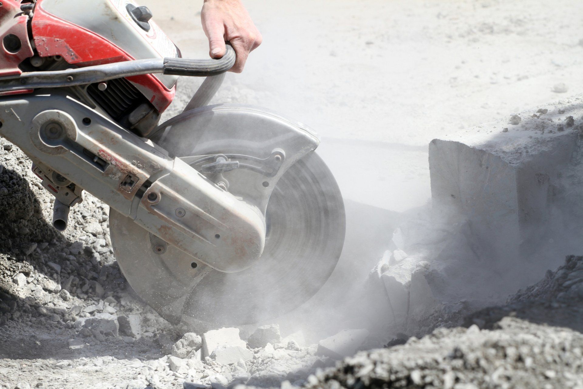 Person Using A Concrete Saw — Watson, LA — Capitol City Concrete Cutters LLC Person Using A Concrete Saw — Watson, LA — Capitol City Concrete Cutters LLC