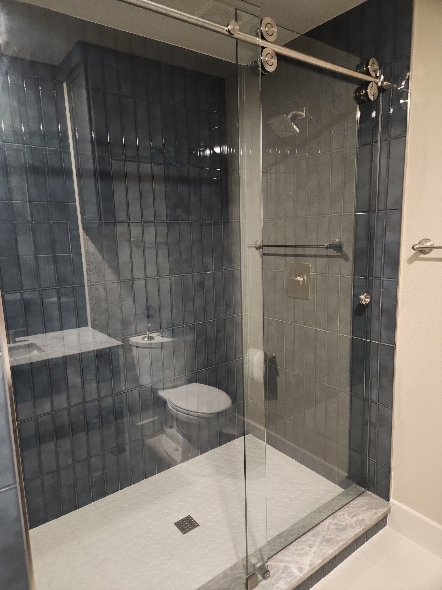 Custom Frameless Sliding Glass Shower Door installed in Southlake, Texas by Davis Glass Service