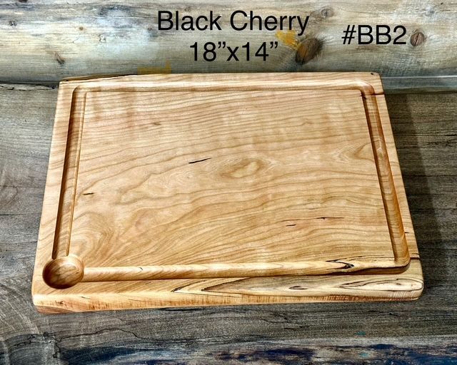 One piece Black Cherry Cutting Board. Large wood cutting board with juice groove.