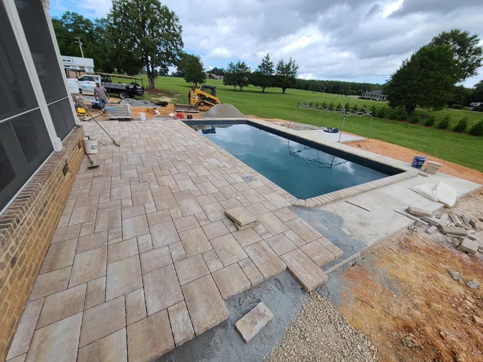 A paver concrete pool deck in Rock Hill, SC by Carolina Mega Concrete LLC