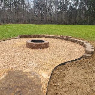 A close up shot of a concrete and stone fireplace in Rock Hill, SC by Carolina Mega Concrete LLC