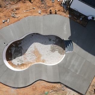 An aerial view of a concrete pool deck in Rock Hill, SC by Carolina Mega Concrete LLC