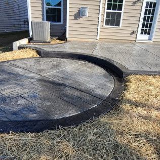 A paver concrete patio with jacuzzi pad in Rock Hill, SC by Carolina Mega Concrete LLC