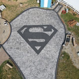 A custom Superman concrete patio in Rock Hill, SC by Carolina Mega Concrete LLC