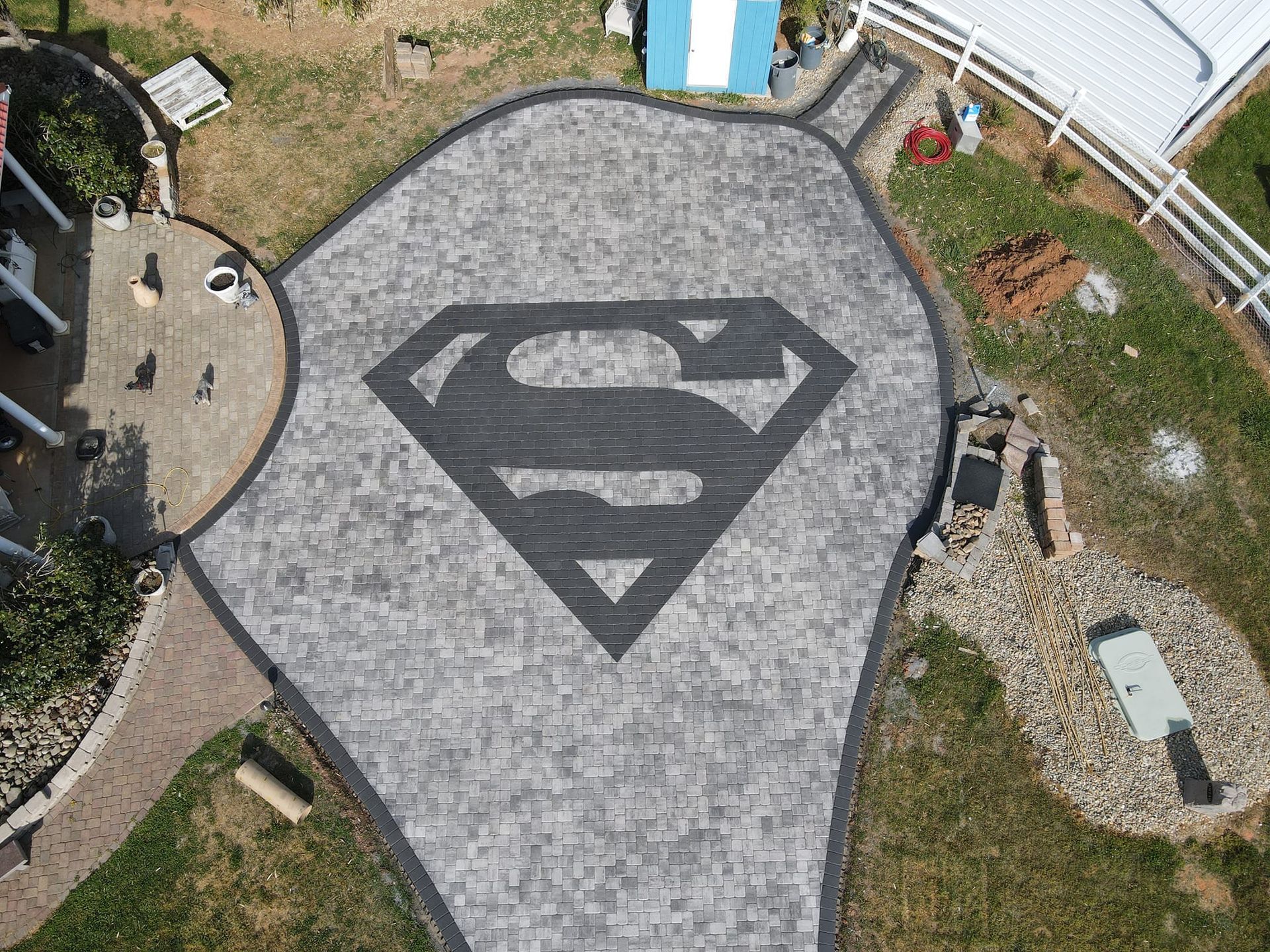 A custom Superman concrete patio in Rock Hill, SC by Carolina Mega Concrete LLC