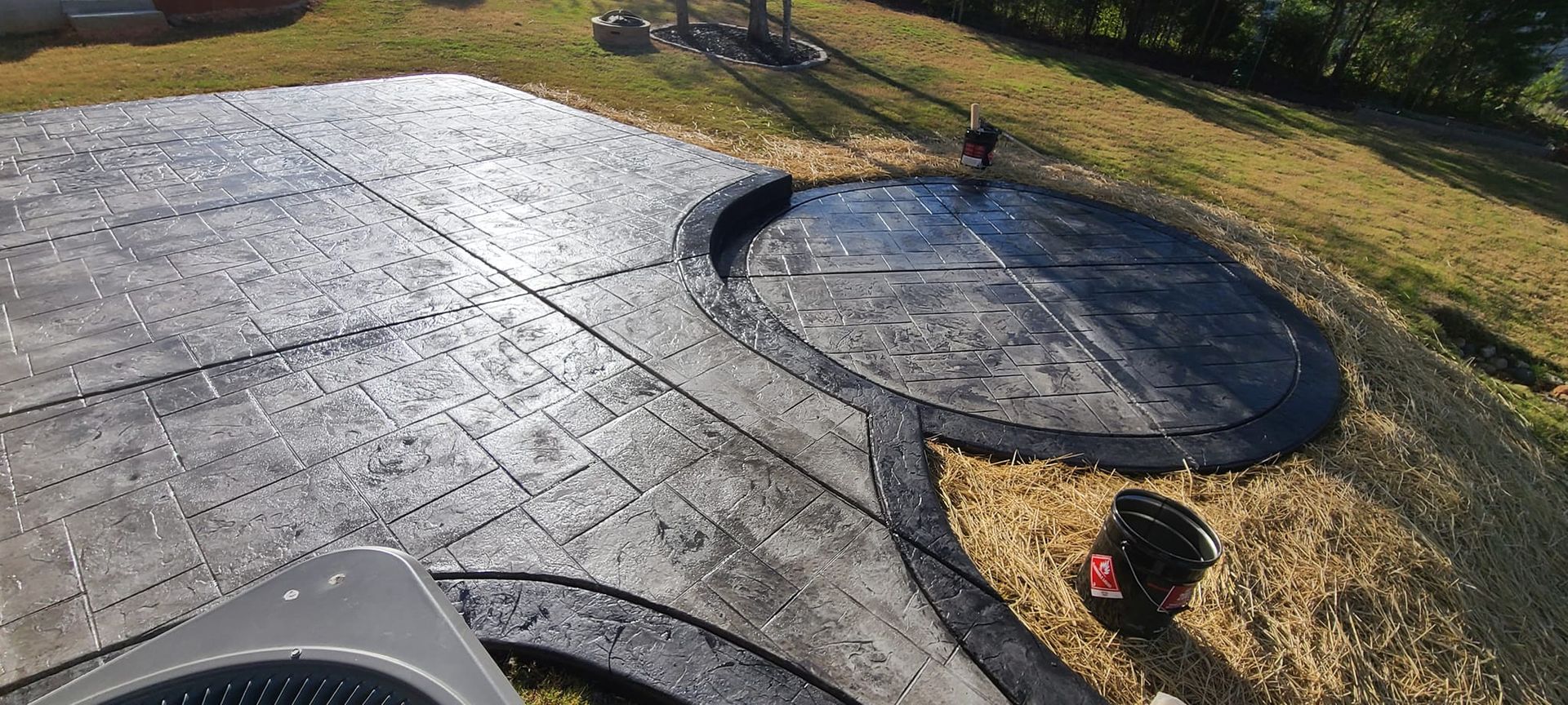 A paver concrete patio with jacuzzi pad in Rock Hill, SC by Carolina Mega Concrete LLC