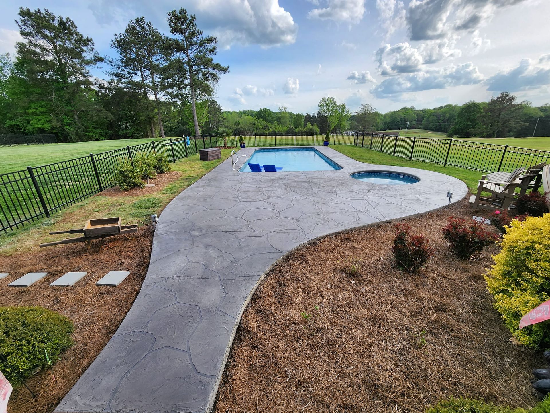 A stamped concrete pool deck in Rock Hill, SC by Carolina Mega Concrete LLC