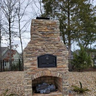 A custom stone fireplace in Rock Hill, SC by Carolina Mega Concrete LLC