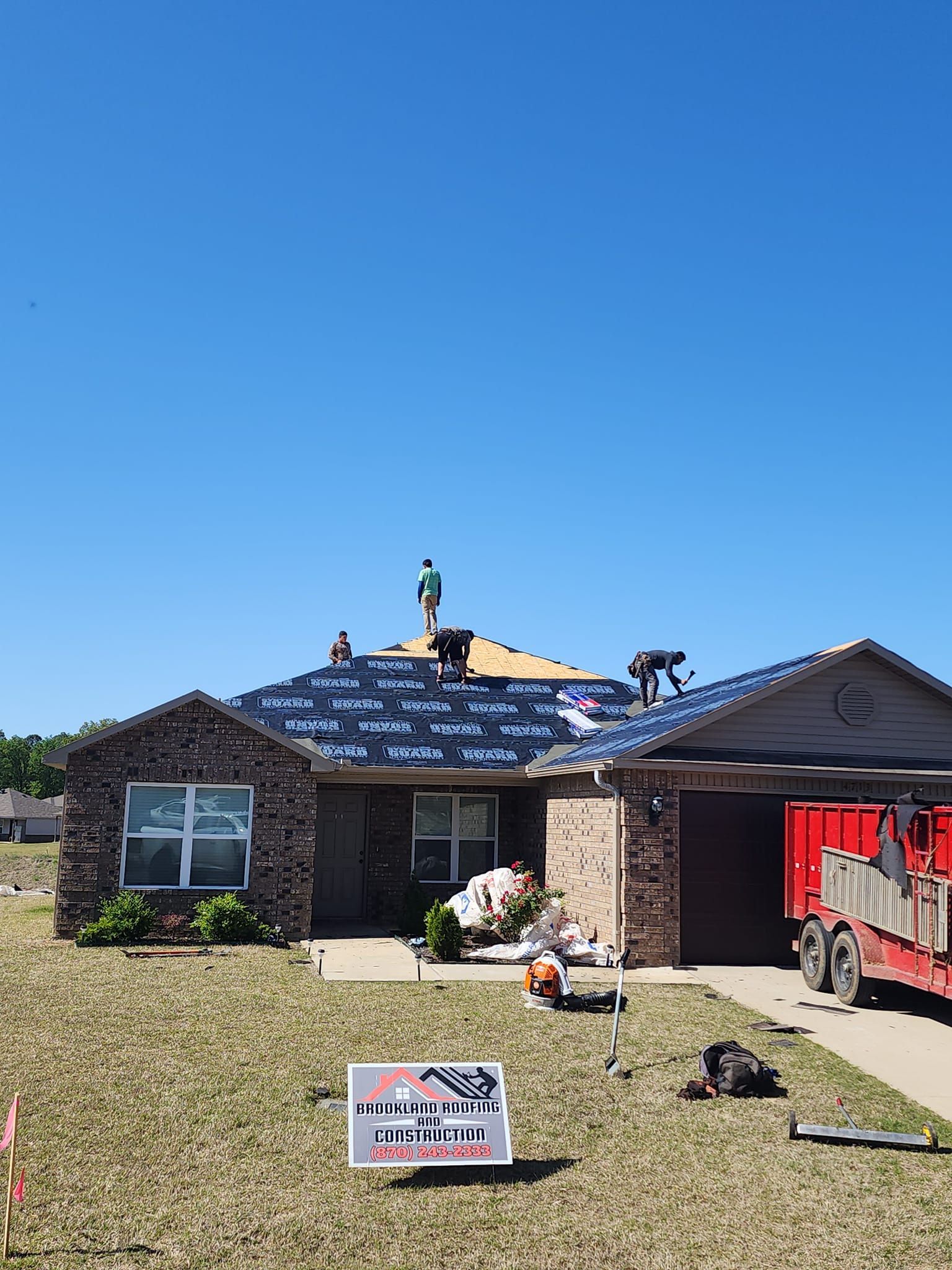 Brookland Roofing Team working on a residential roo in Brookland, AR