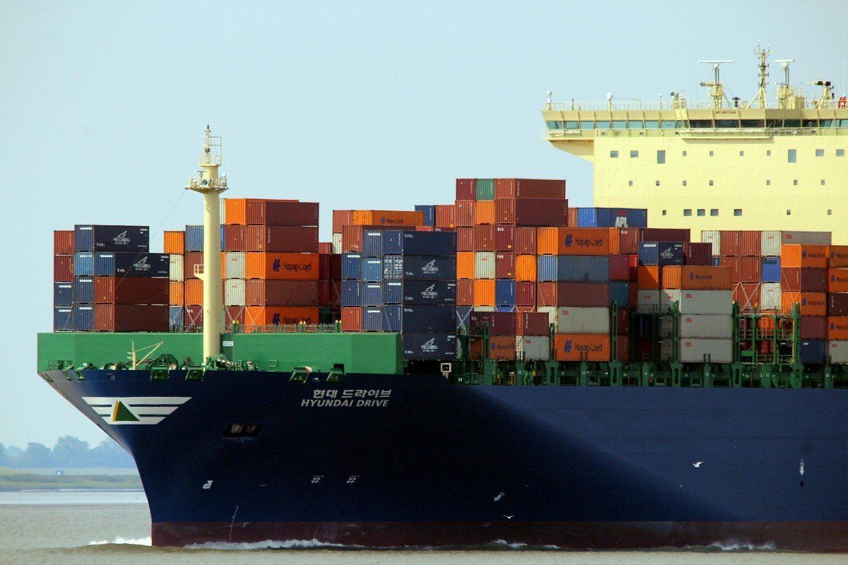 A large container ship filled with lots of containers