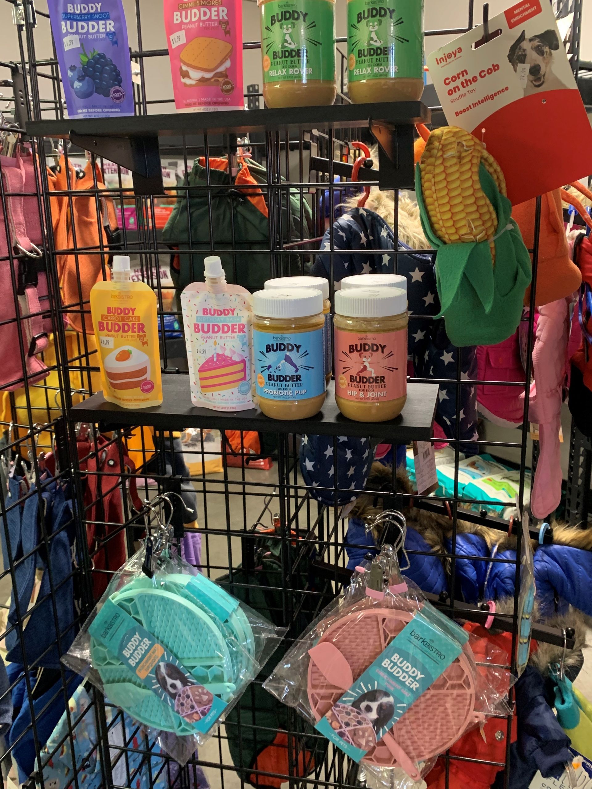 A display of dog treats and toys in a store