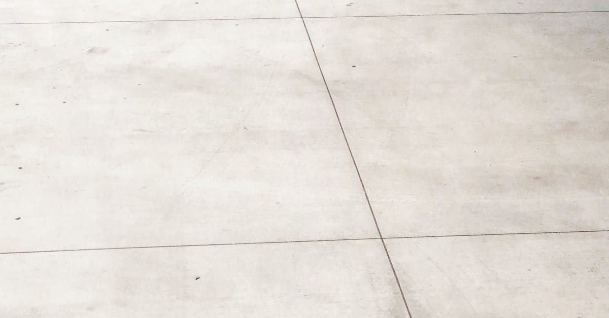 A close up of a concrete floor with a diagonal line.