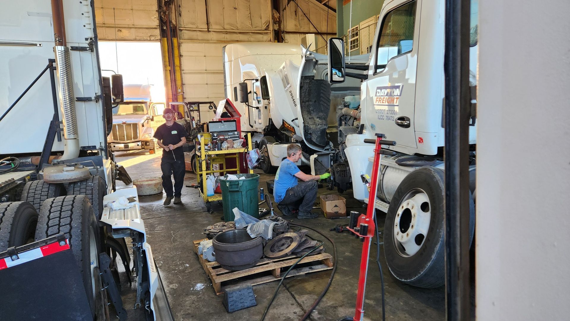 diesel mechanics working on semi trucks