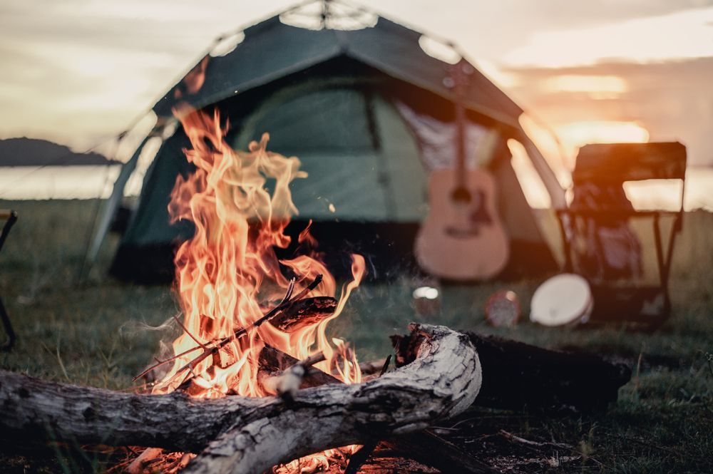 A Campfire in Front of A Tent and A Guitar — Edmonds Landscaping Supplies in Bohle Plains, QLD