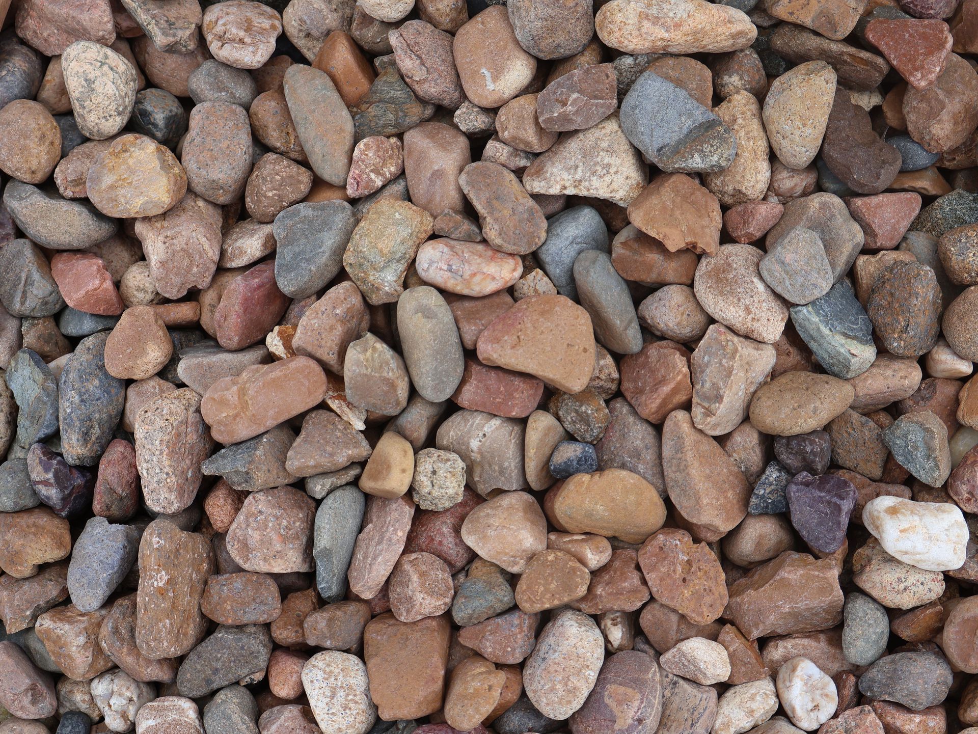 A pile of rocks of different sizes and colors  — Edmonds Landscaping Supplies in Bohle Plains, QLD
