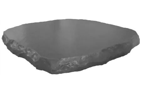 A Gray Rock Is Sitting On Top Of A White Surface — Edmonds Landscaping Supplies in Bohle Plains, QLD