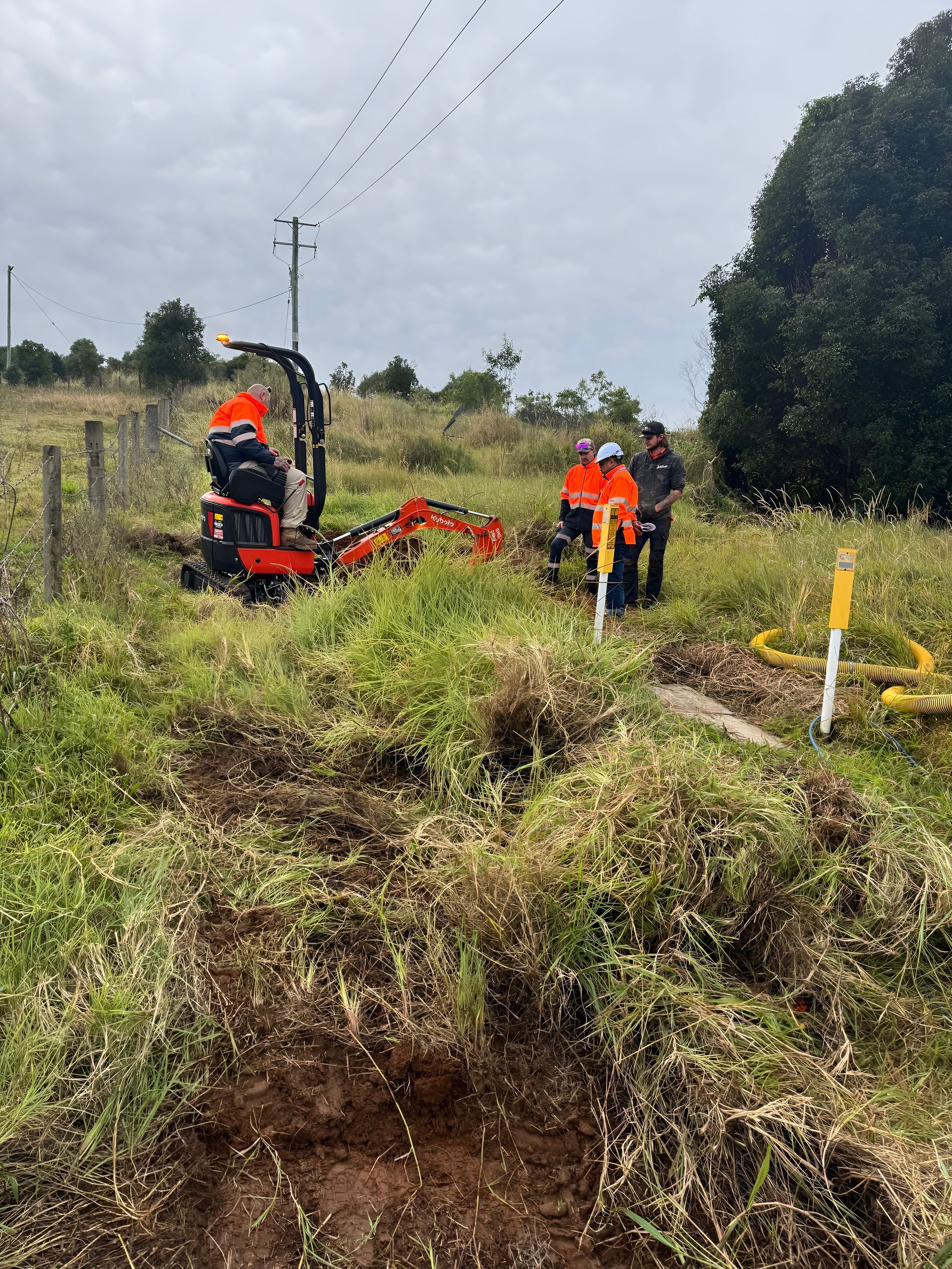 Workers With Machinery Near a Power — Gold Coast Leak Detection in Mudgeeraba, QLD