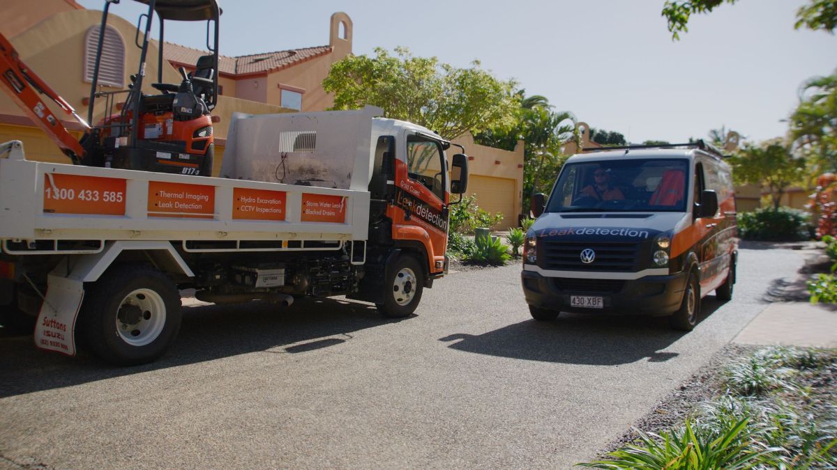 A Man is Working on a Pipe in the Dirt  — Gold Coast Leak Detection in Palm Beach, QLD 