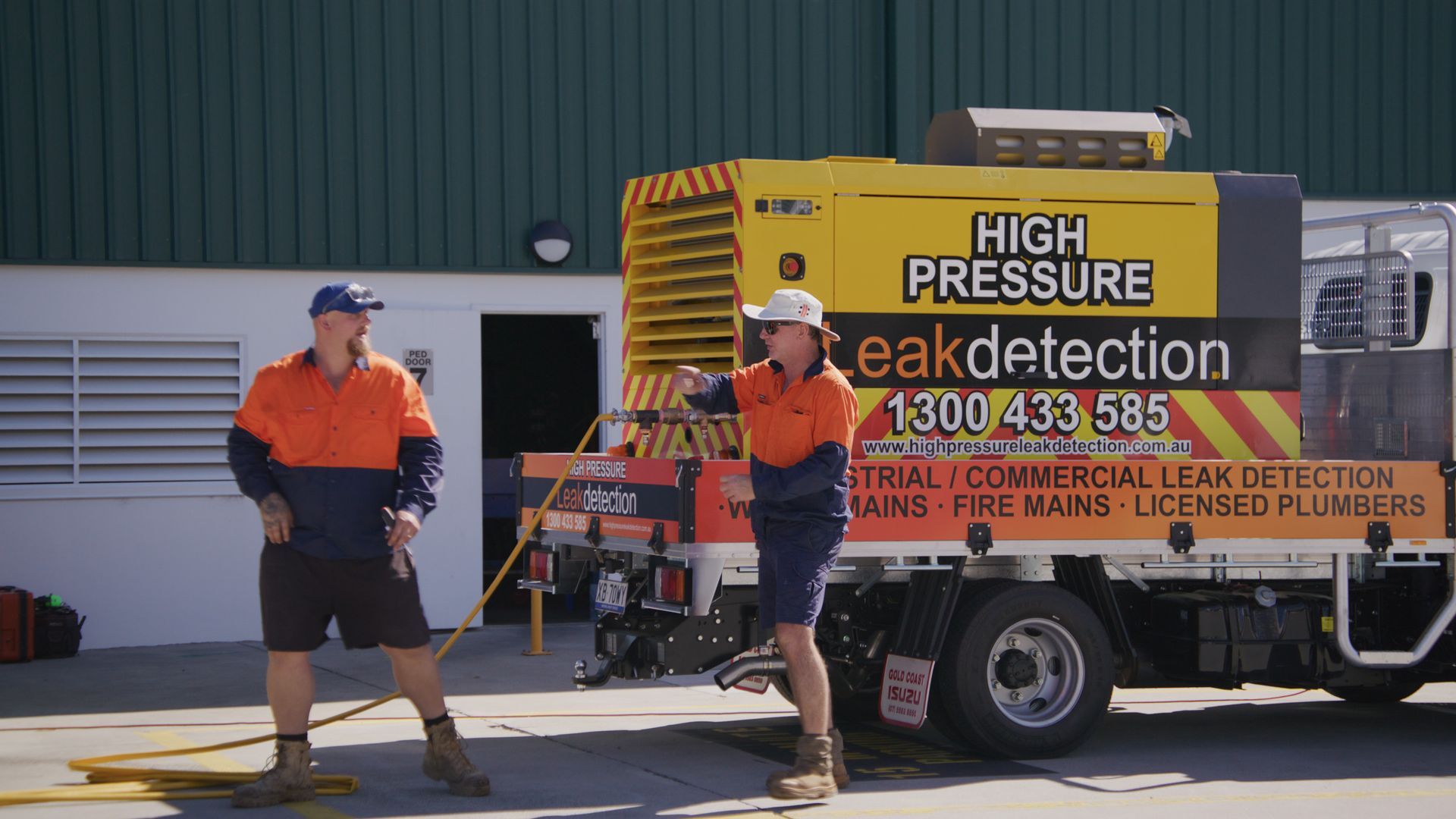 Two Men In Work Clothes By A Truck Labeled — Gold Coast Leak Detection in Mudgeeraba, QLD 