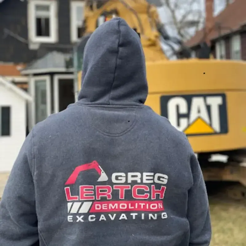 A man in a hoodie with Greg Lertch Excavation written on it
