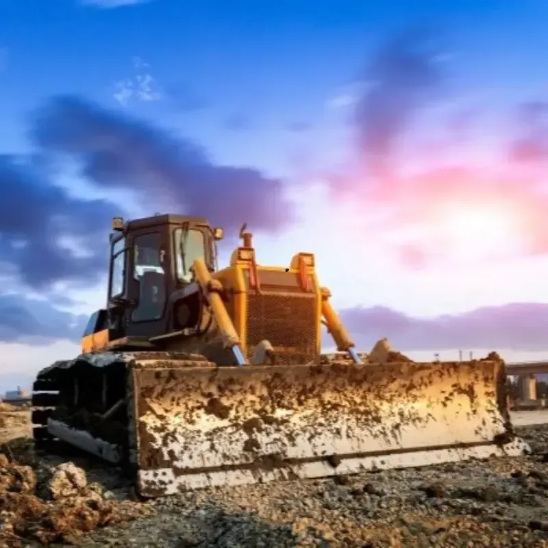 A bulldozer parked in front of a building
