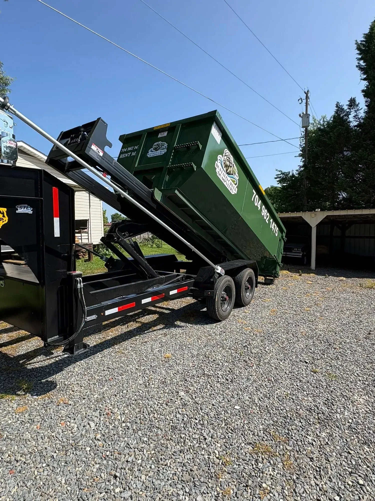 A dumpster is being dropped at a residential property in Stanly County, NC