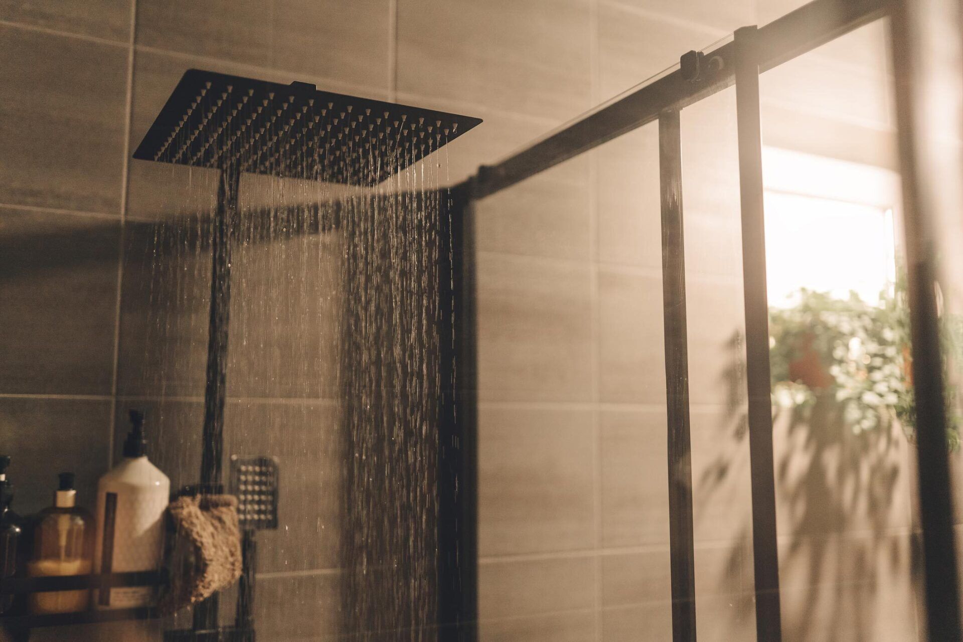 Close Up Of Water Flowing From Shower In The Bathroom — Houston, TX — Richter’s Services Inc.