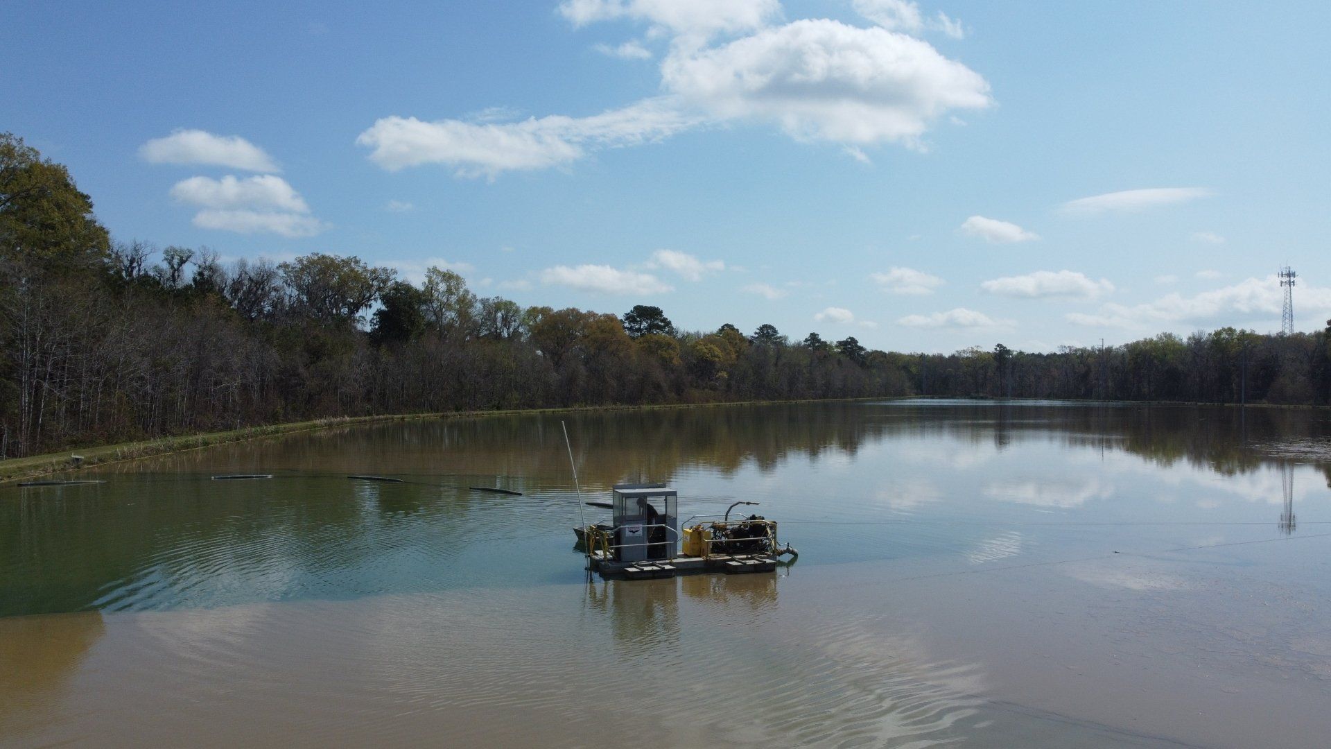 A boat is floating on top of a large body of water.