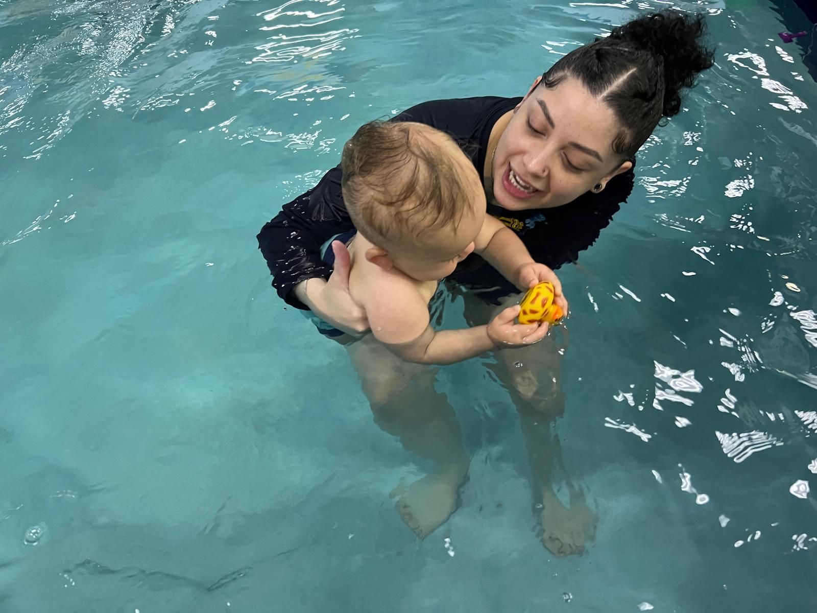 Reasons Why Your Child Should Take Swim Lessons Photo of children training in the swimming pool