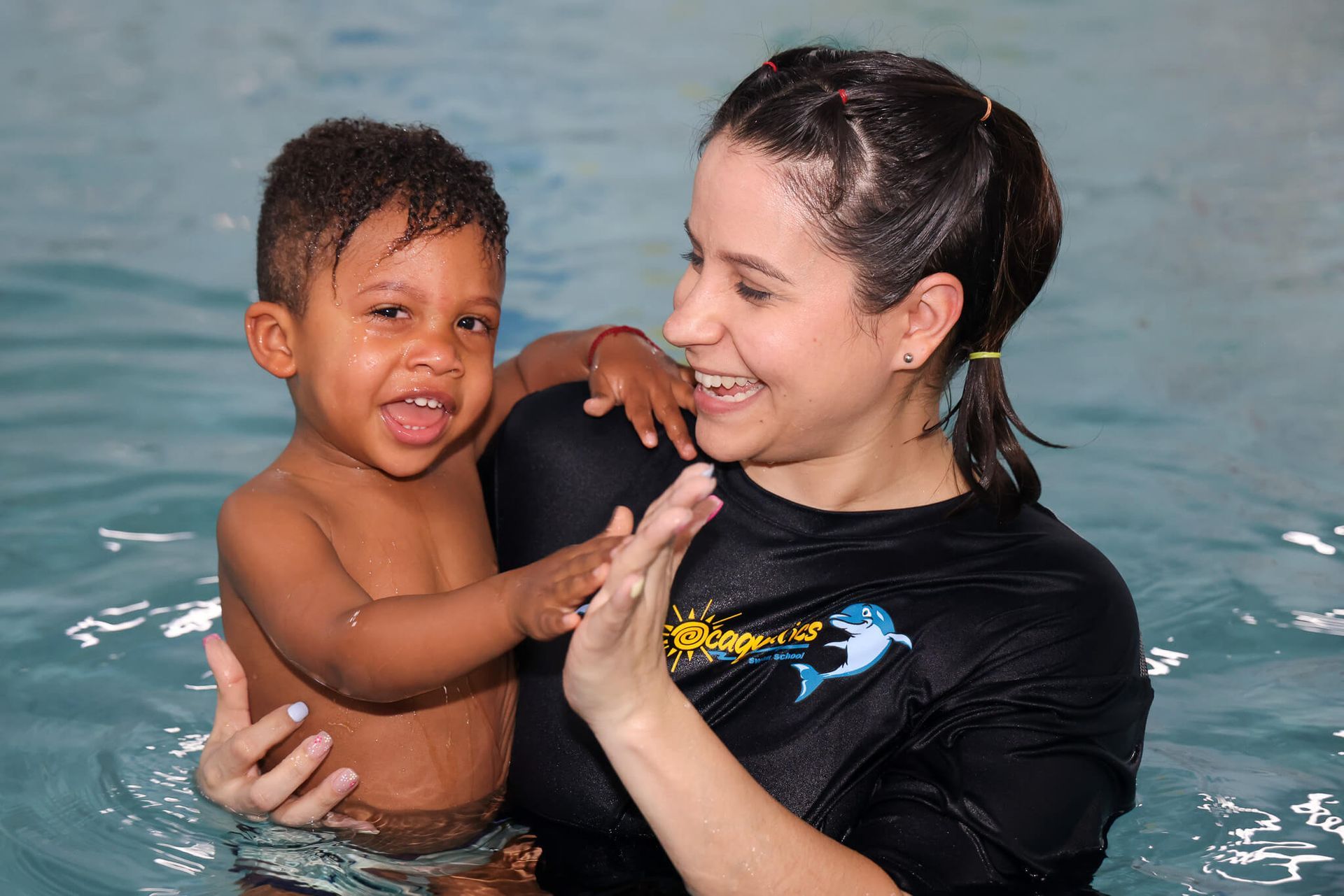 Teacher and child in the pool