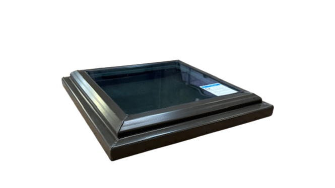 A square piece of metal is sitting on top of a white surface.