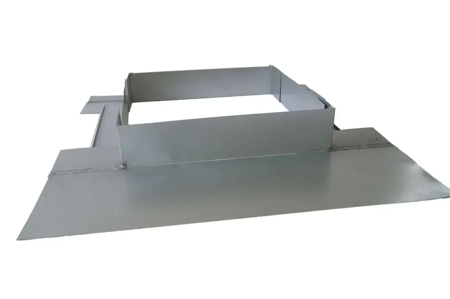 A metal tray with a square hole in the middle on a white background.