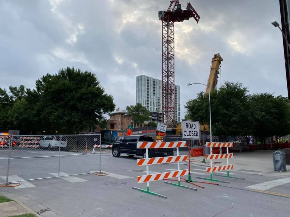 A construction site with a sign that says road closed