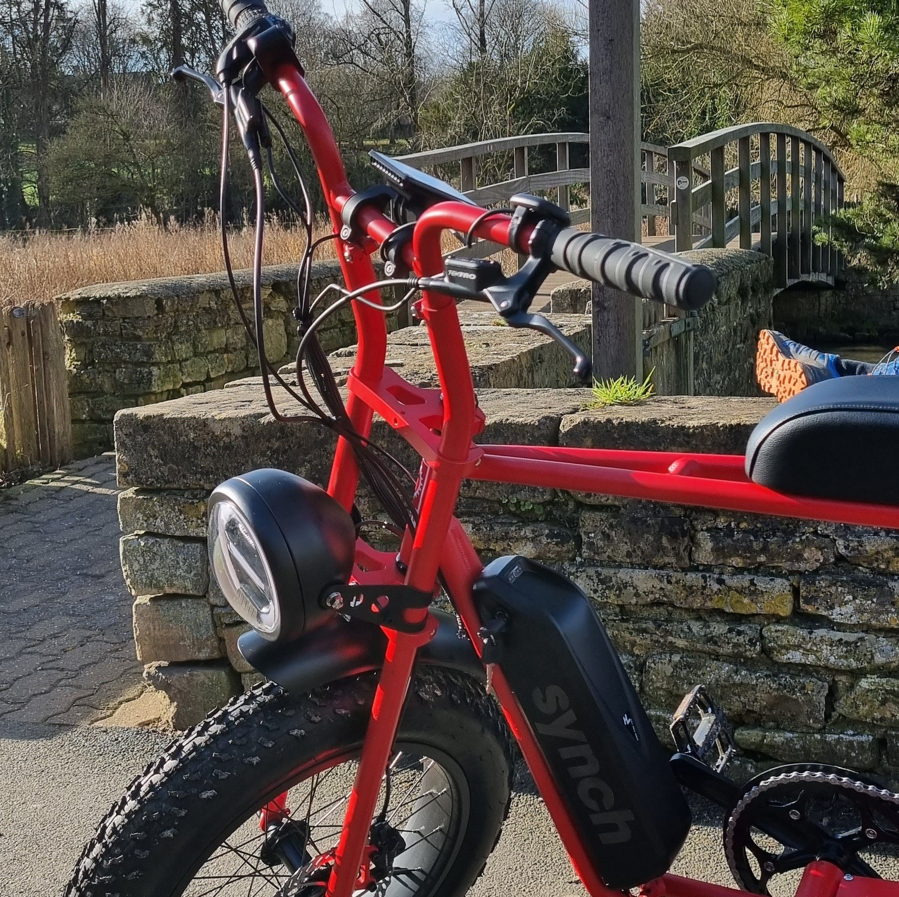 A red bicycle with the word syncr on the front