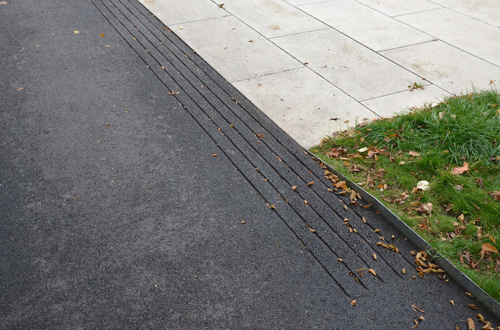 An asphalt street surface with safety grooves. An asphalt street surface with safety grooves.