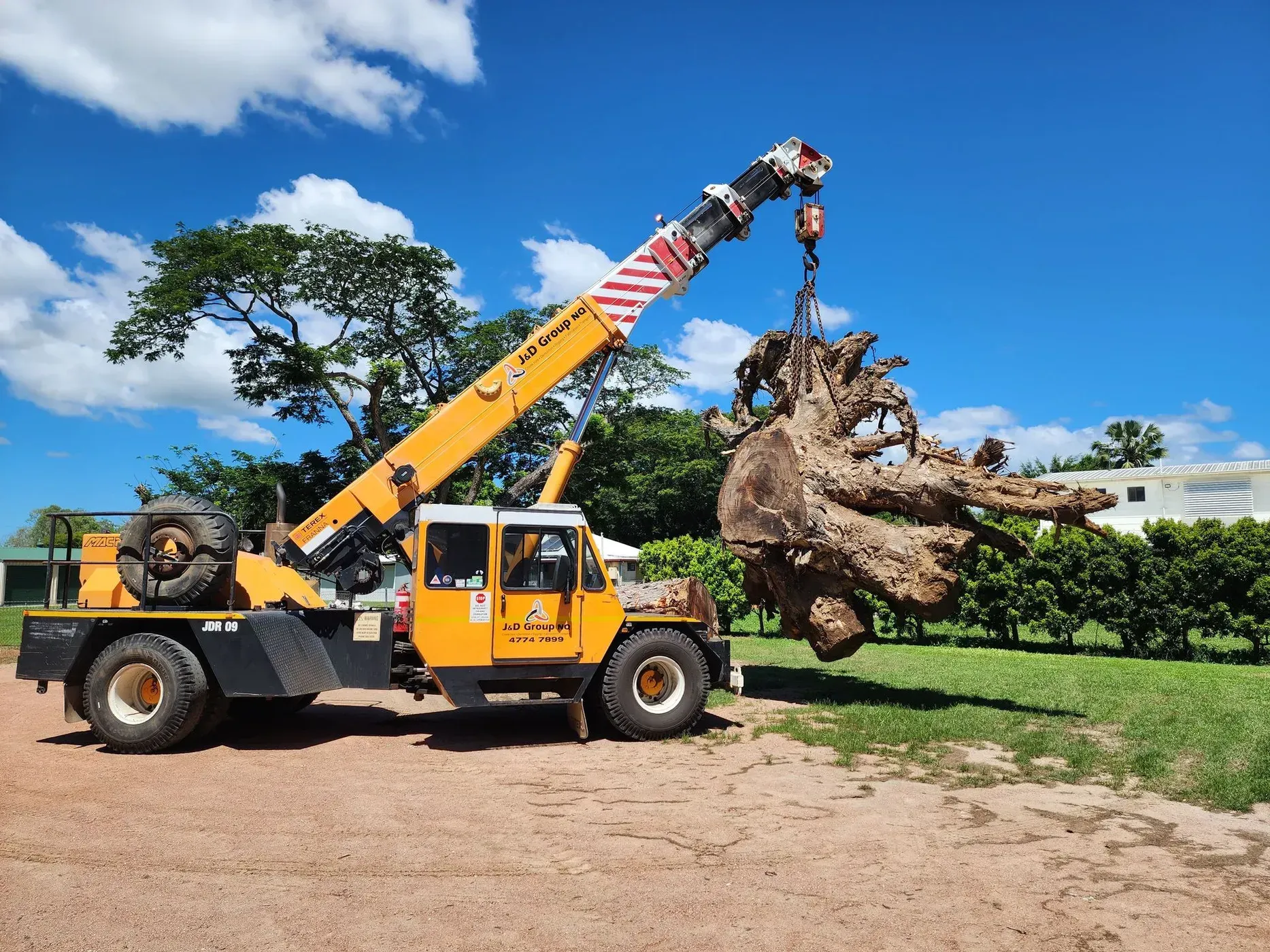 A Large Swimming Pool Is Being Lifted By A Crane — J & D Rigging Pty Ltd In Bohle, QLD