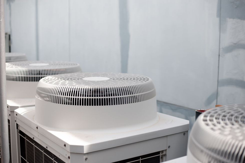 Row of white industrial ventilation units in a clean room
