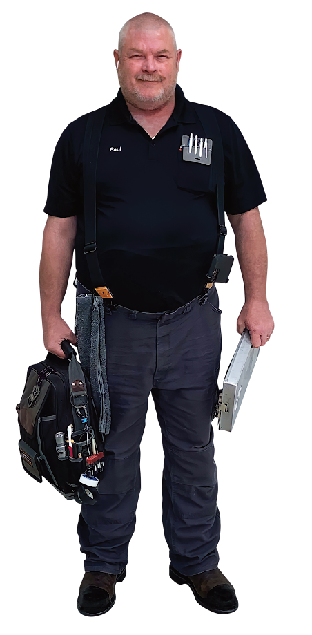 Man in black polo and jeans holding a camera bag and a metal case against a white background