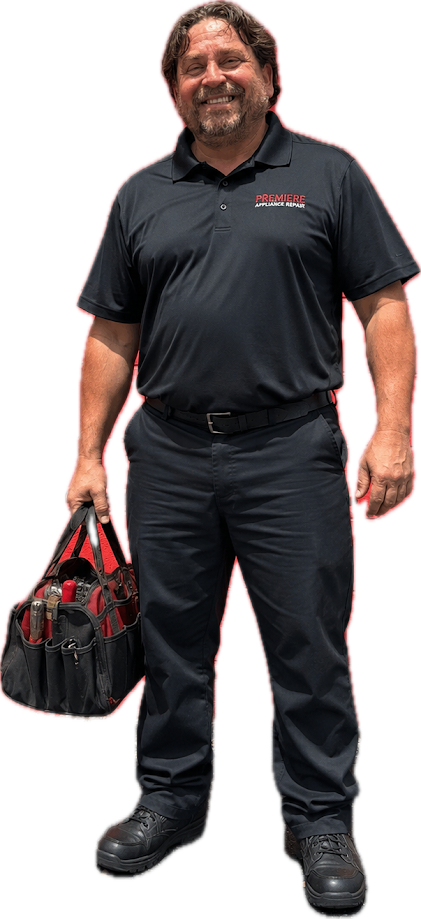 Man in black polo and pants holding a red-and-black bag, standing against a white background