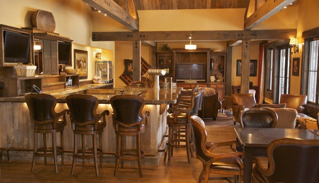 A large room with tables and chairs and a bar