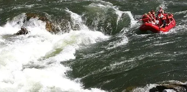 A group of people are rafting down a river.