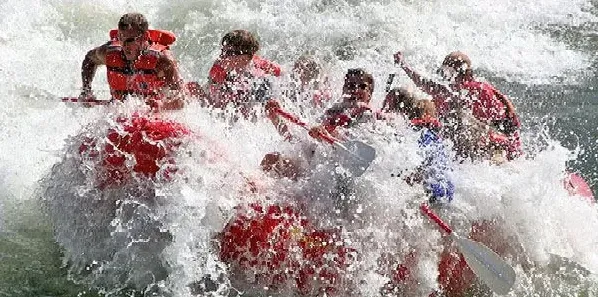 A group of people are rafting down a river.