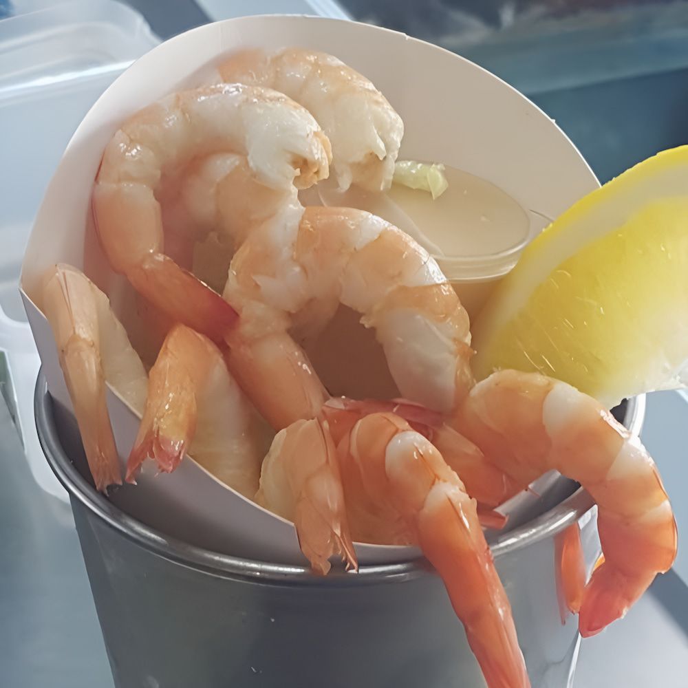 A Bucket Filled With Shrimp And A Slice Of Lemon — Mulgrave Seafoods In Bungalow, QLD