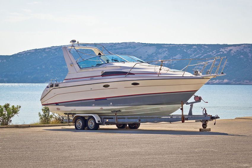 A Boat on a Trailer Near the Water — Mackay Marine Services in Moranbah, QLD
