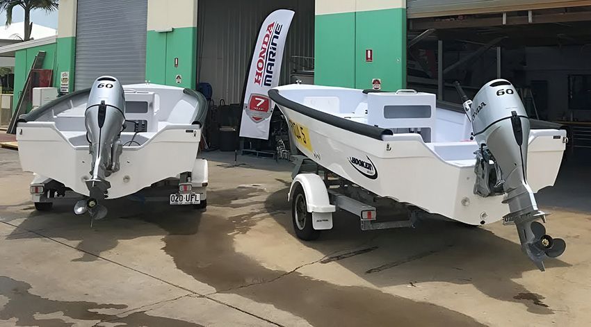 Two Boats Are Parked Next to Each Other — Mackay Marine Services in Bowen, QLD