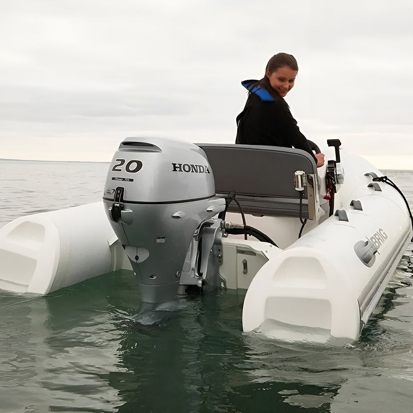 A Woman is Sitting on a Boat with a Honda Motor ā Mackay Marine Services in Mackay, QLD