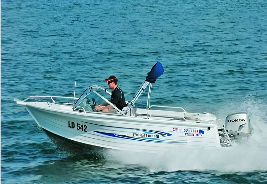 A Man is Driving a Boat ā Mackay Marine Services in Mackay, QLD
