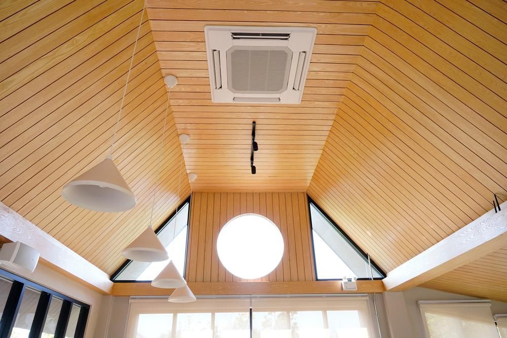 View of the ceiling with lights hanging and ducted airconditioning — Sparky Mid North Coast In Forster, NSW
