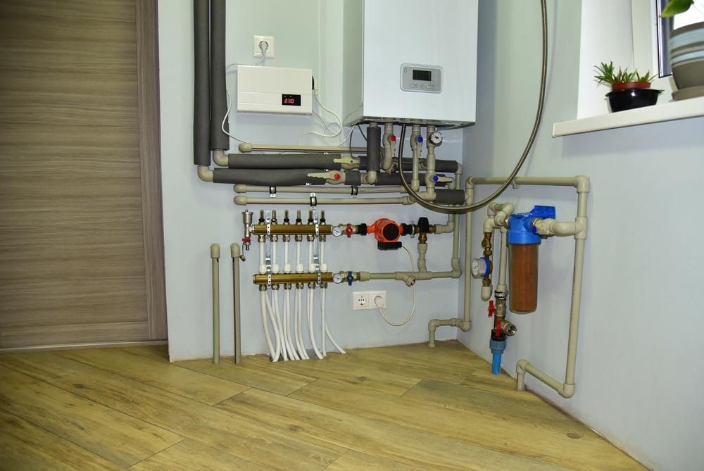 A Room With a Lot of Pipes and a Boiler on the Wall — Sparky Mid North Coast In Forster, NSW