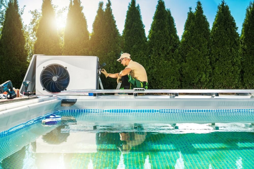 A Man is Installing an Air Conditioner on Top of a Swimming Pool — Sparky Mid North Coast In Forster, NSW